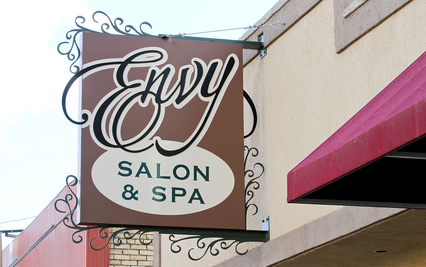 Envy Salon & Spa Wahpeton ND Wall Cabinet on Storefront with custom brackets