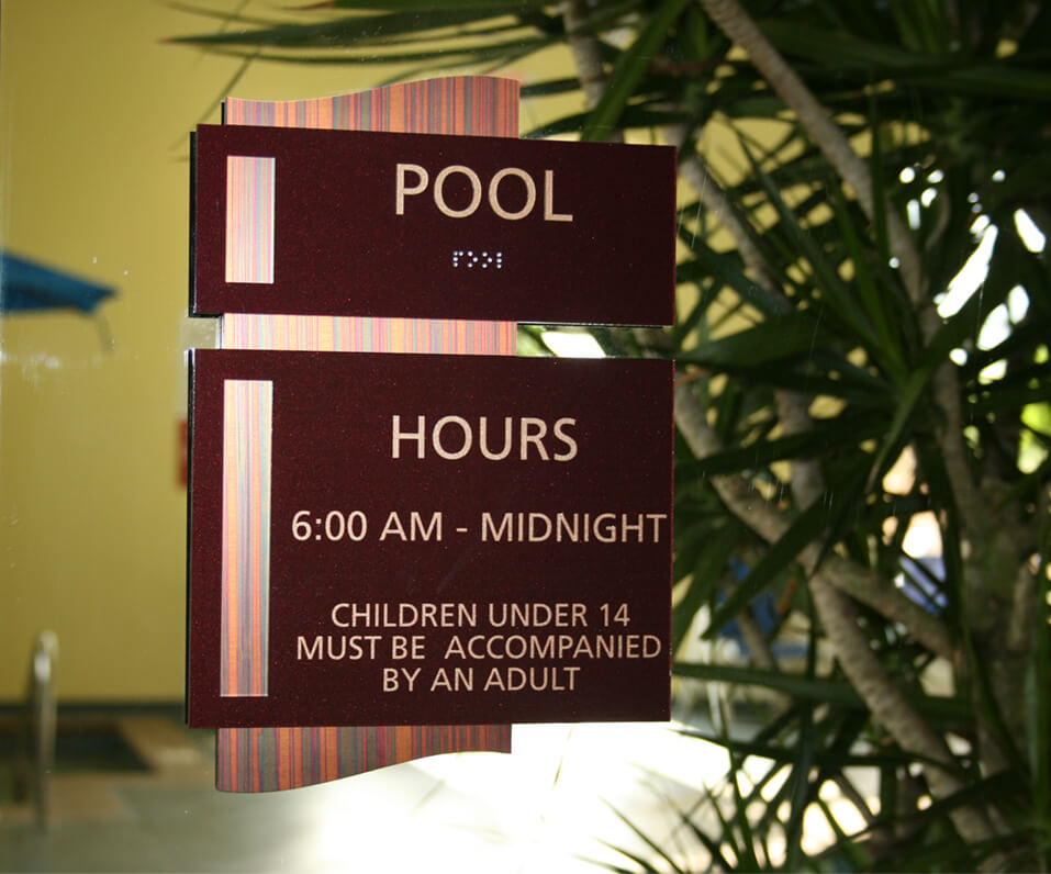 Pool ADA Sign installed on Glass Panel