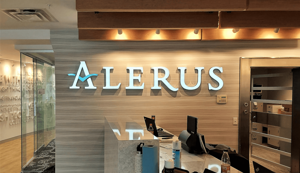 Alerus Financial Excelsior MN interior illuminated channel letters on wood grain wall and dimensional word wall