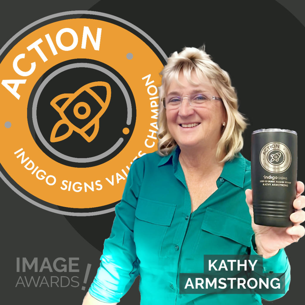 Kathy Armstrong posing with custom mug Action IMAGE AWARD Q3 2023